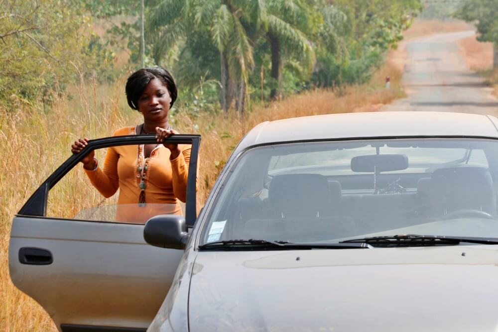 Safe Travel tips: African women get out of car during travel African women get out of car during travel