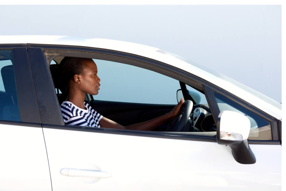 Untitled design (17) young woman driving car