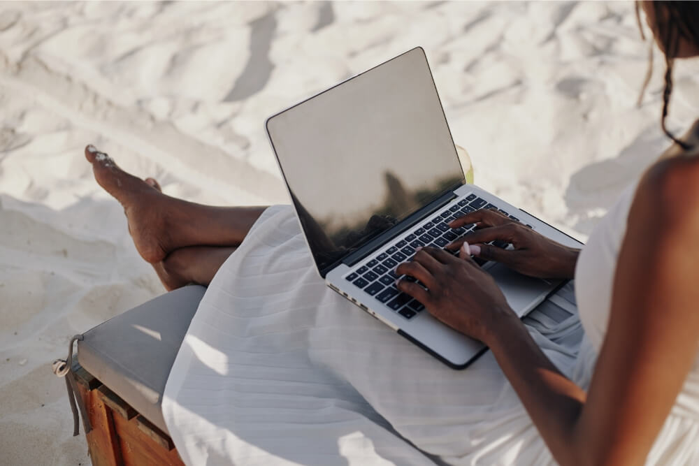 Untitled design (19) young woman working remotely